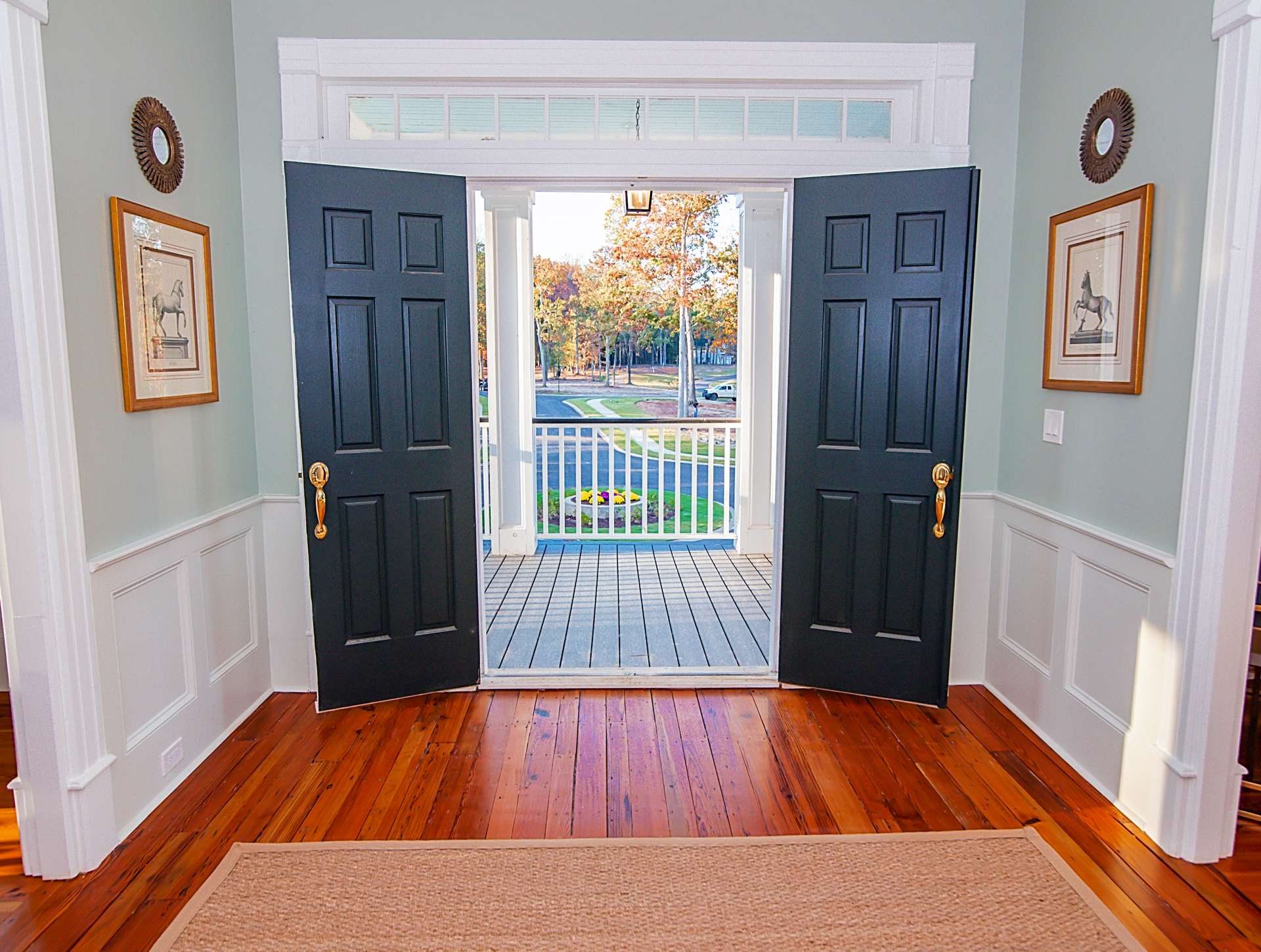 Double Doors Lead to the Upper Level Portico Overlooking the Front Entrance of the Fully Restored historic Clubhouse at Stewart Landing on Lake Murray