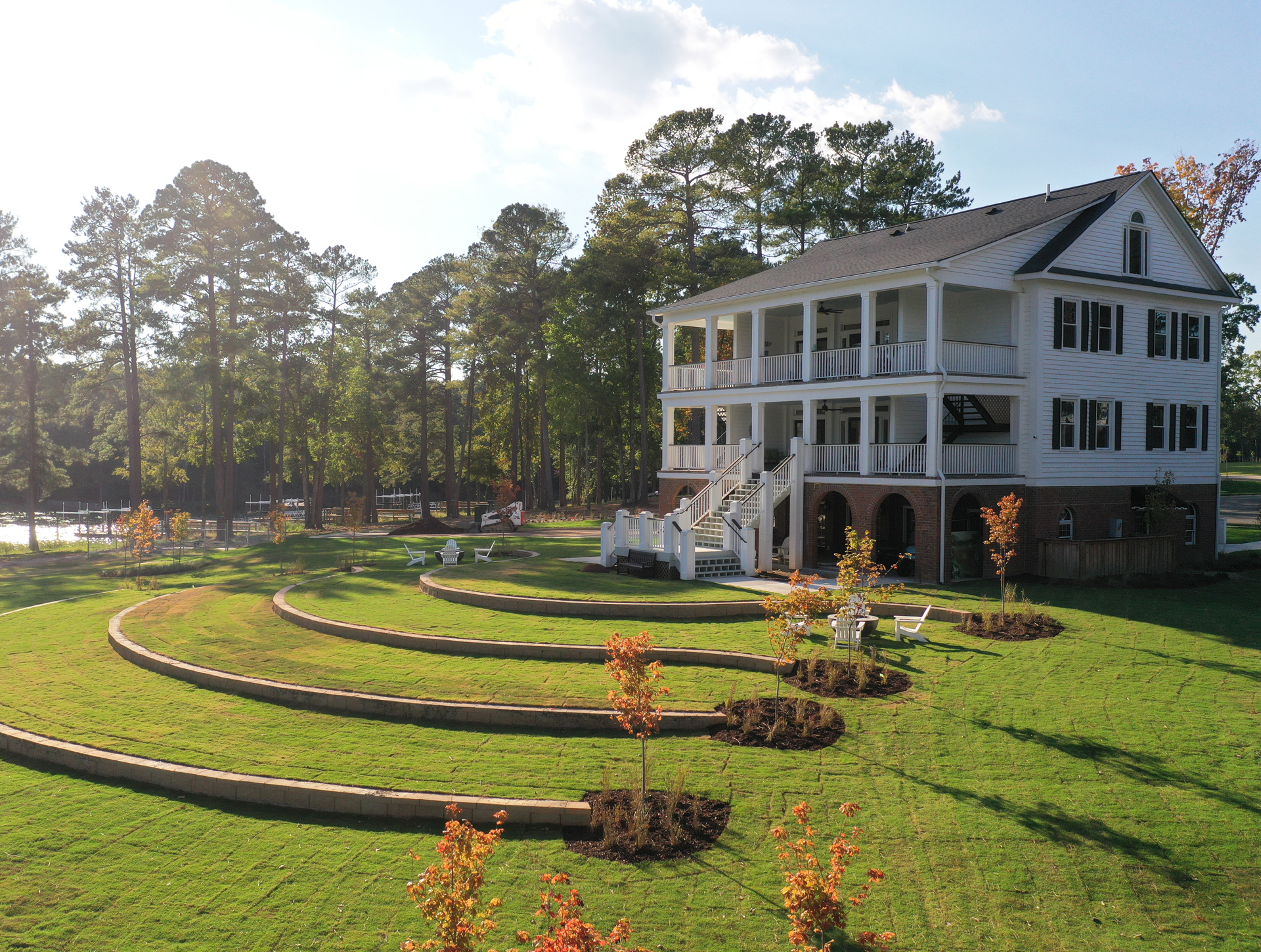 The Historic Clubhouse Atop The Slope with the Amphitheater Tiered Towards the Lake