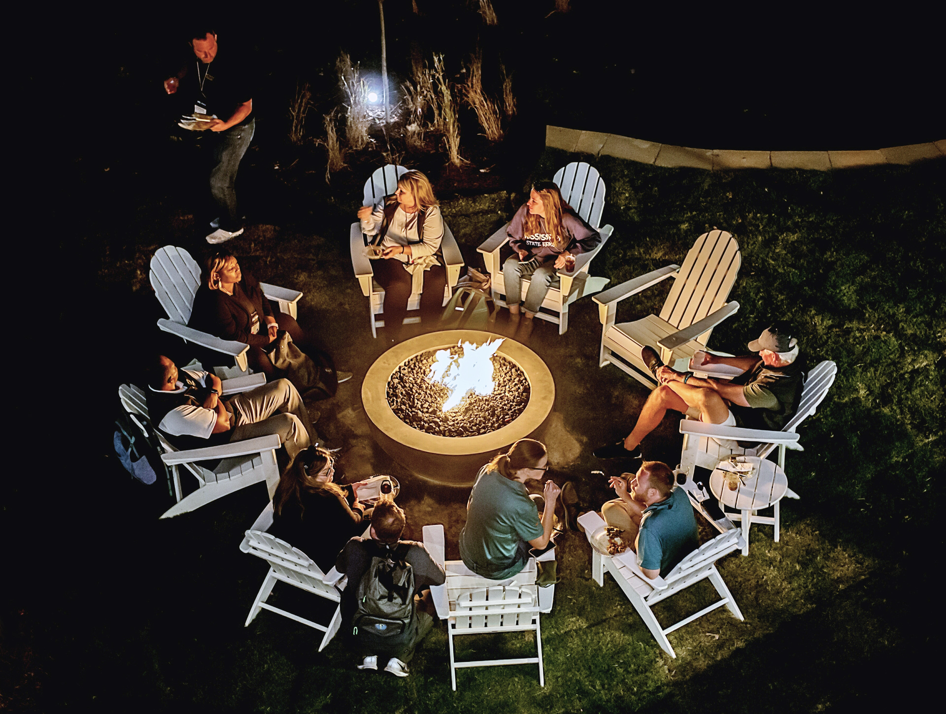 Adirondack chairs and fire pits await along the amphitheater and edge of the shoreline overlooking the private marina and lake at Stewart Landing on Lake Murray