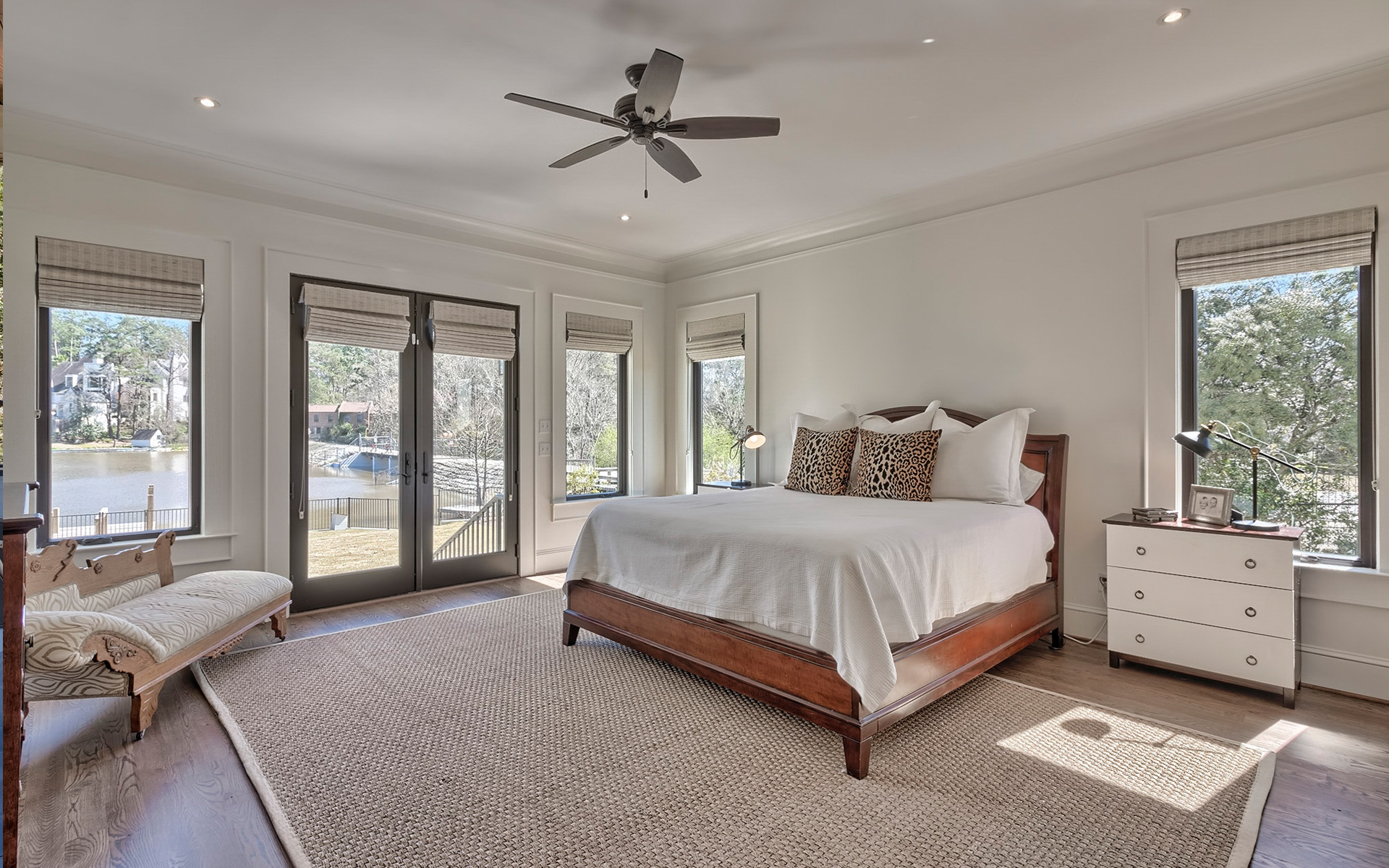 LaFaye Custom Home Builders' Master Bedroom with Private Entrance to the Back Patio