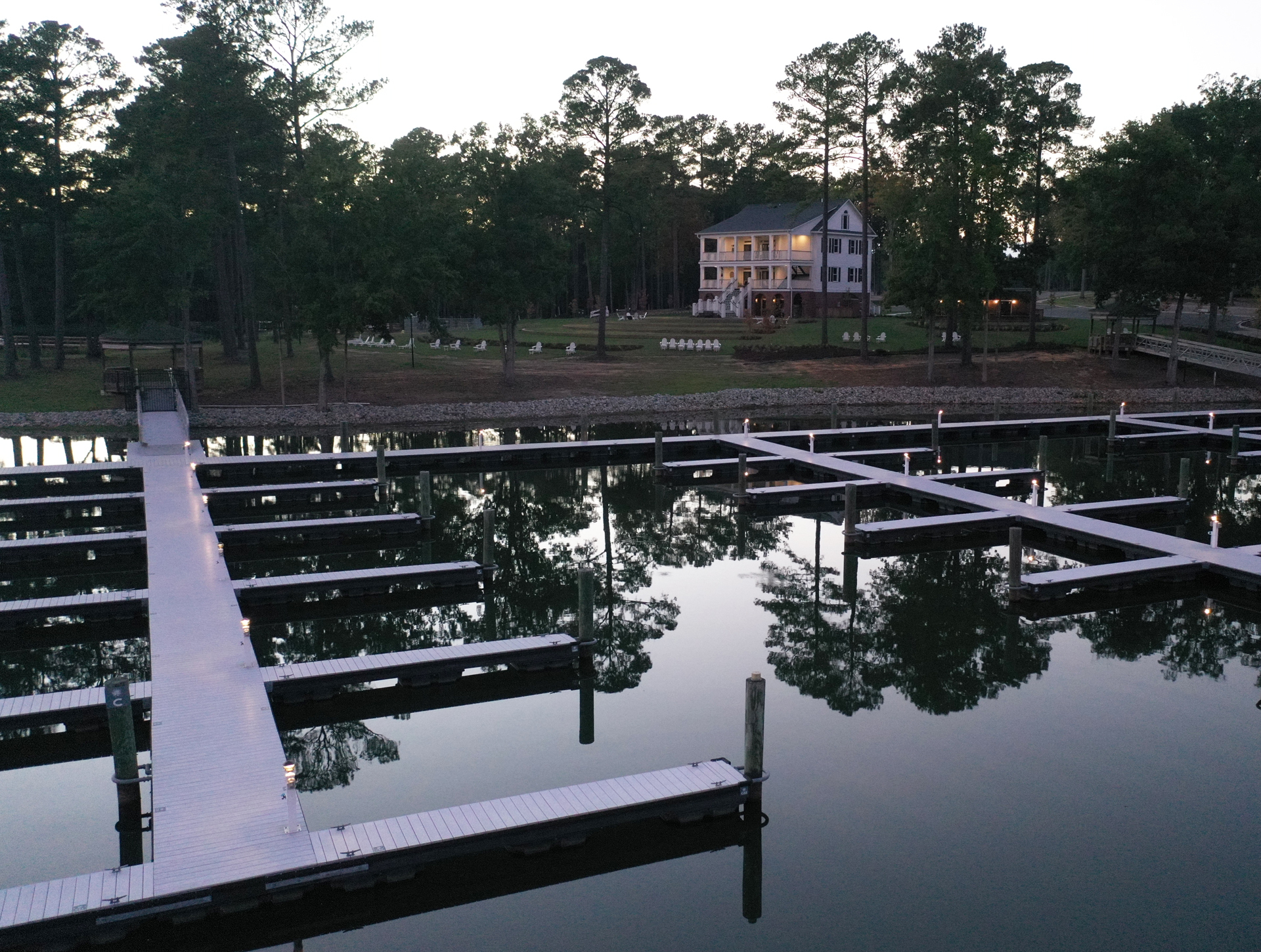 Views of the Private Marina with Lights from the Water at Dusk