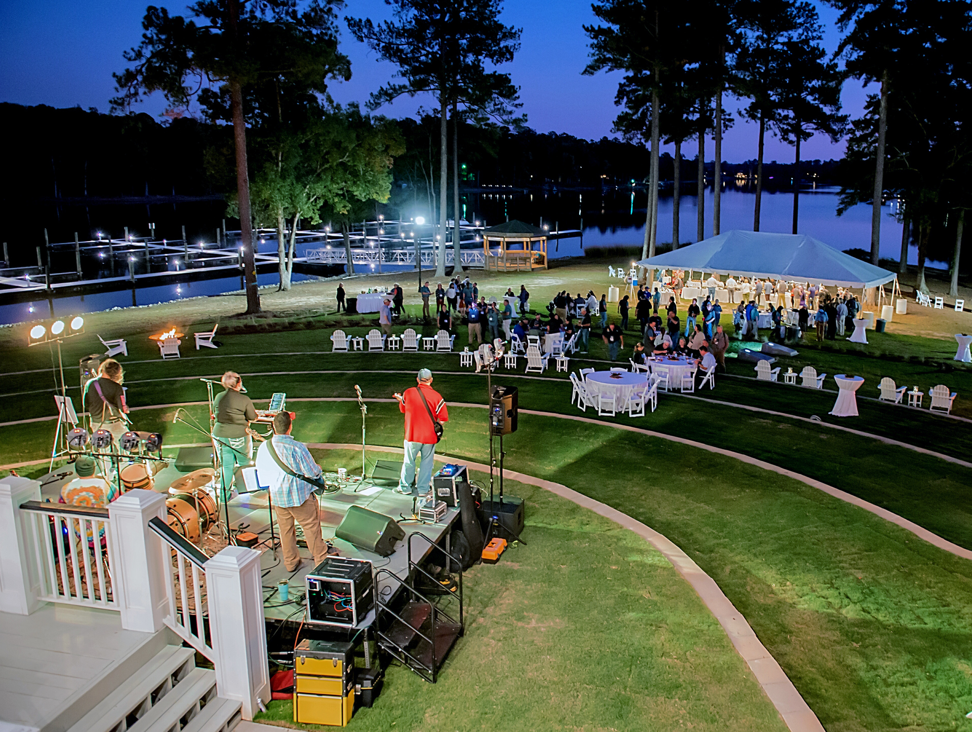 Adirondack Chairs and fire pits await along the amphitheater and edge of the shoreline overlooking the private marina and lake at Stewart Landing on Lake Murray